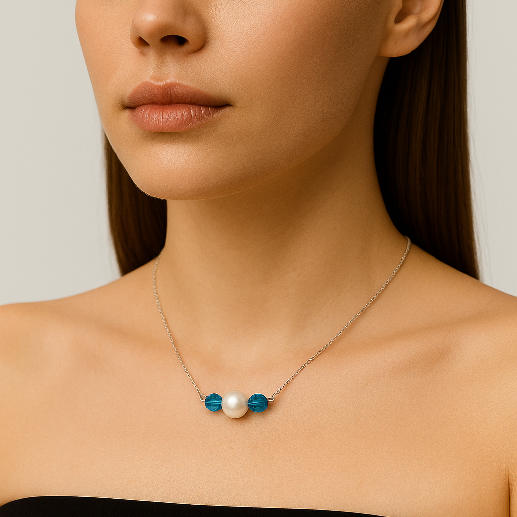 Silver necklace with blue beads and white pearl.