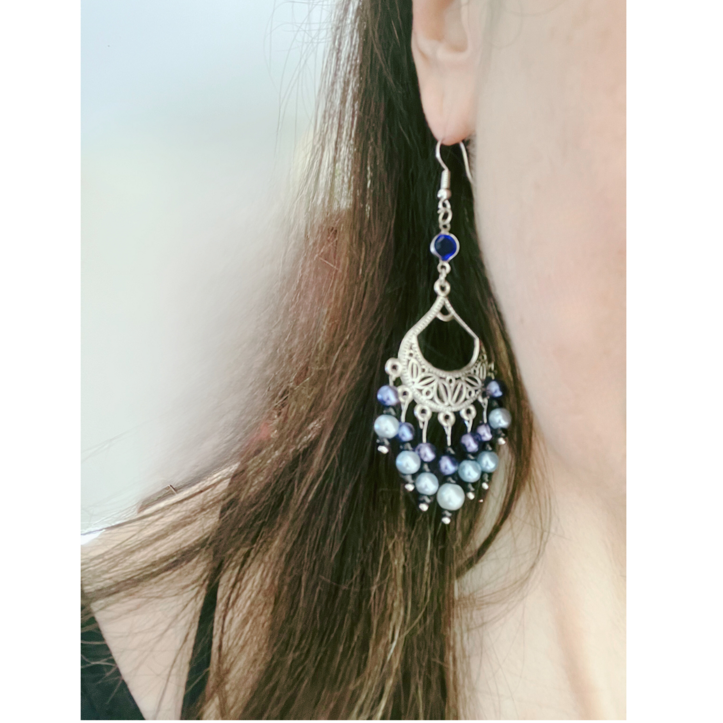 Blue bleads silver dangling earrings.