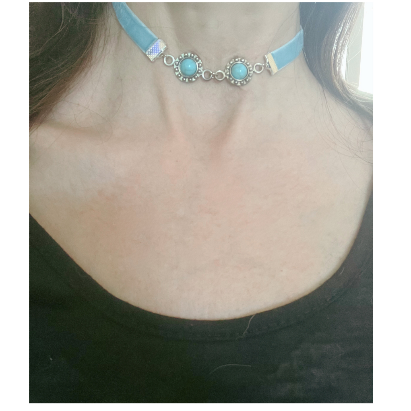 Blue choker with beads.