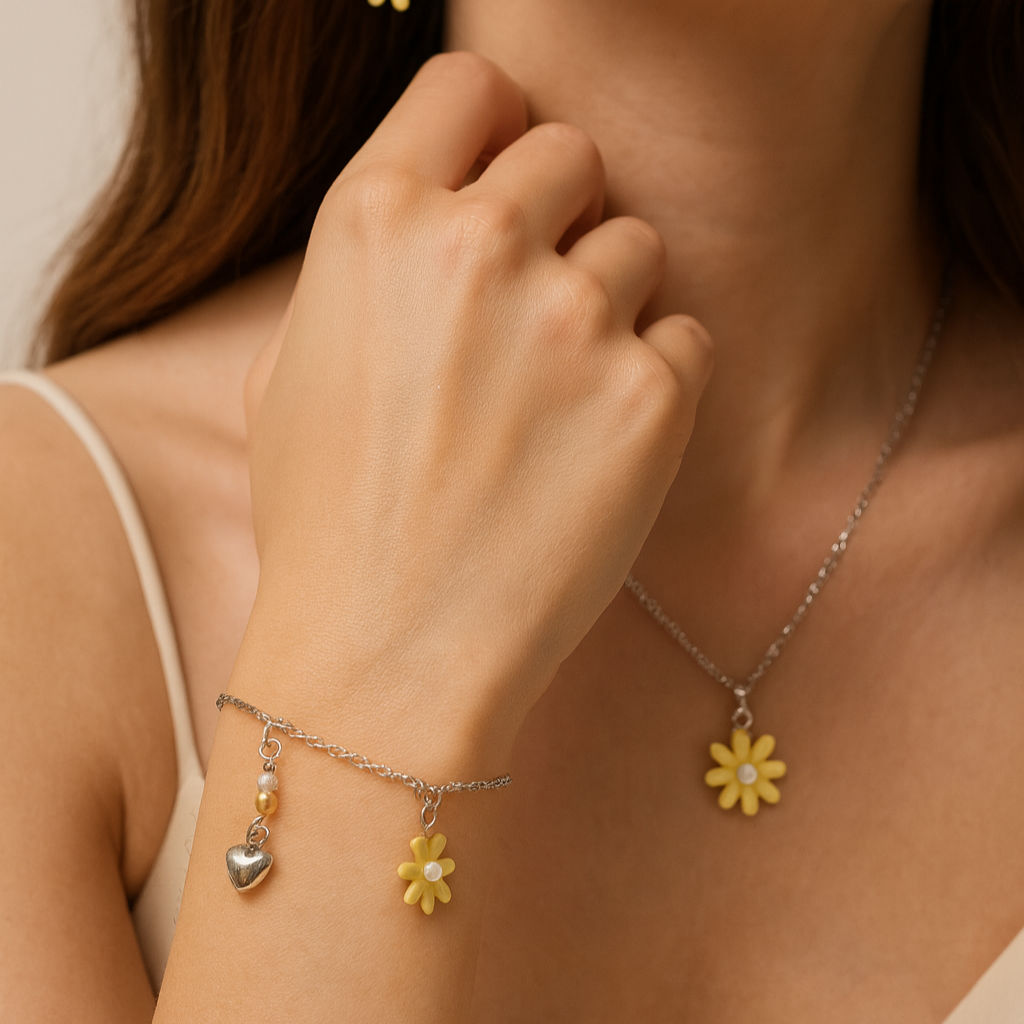 Silver bracelet with daisy and charms