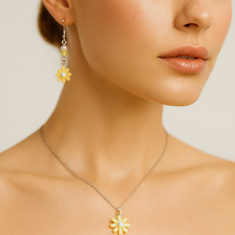Silver necklace with daisy pendant and matching daisy earrings.
