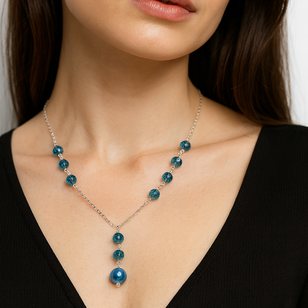 Silver necklace with blue beads.