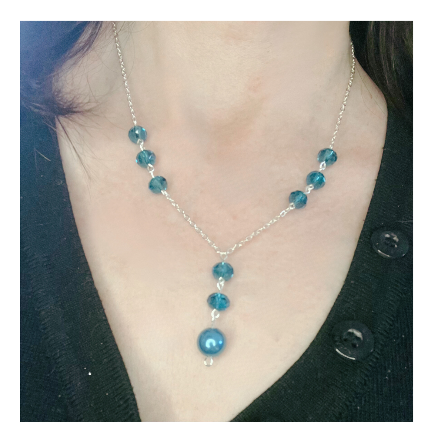 Beautiful silver necklace with blue beads.