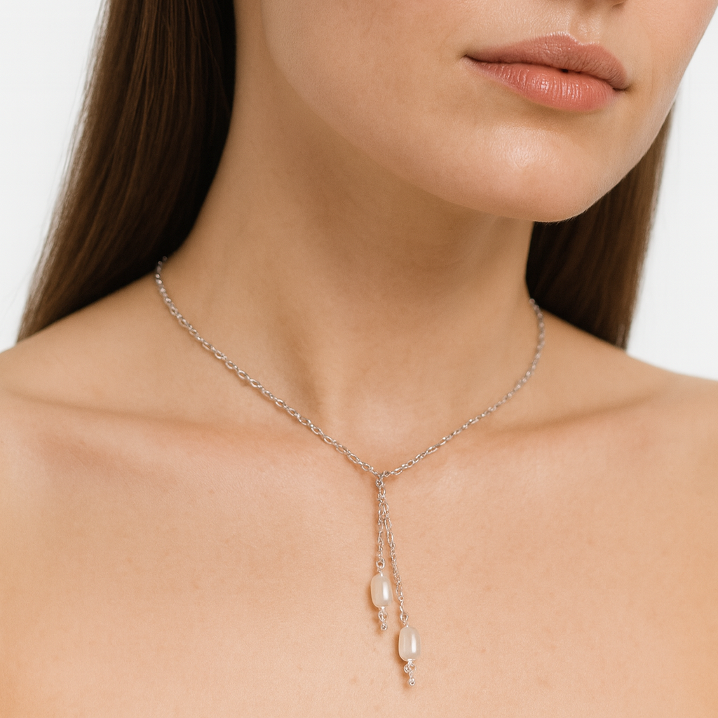 Silver necklace with pearl drops.