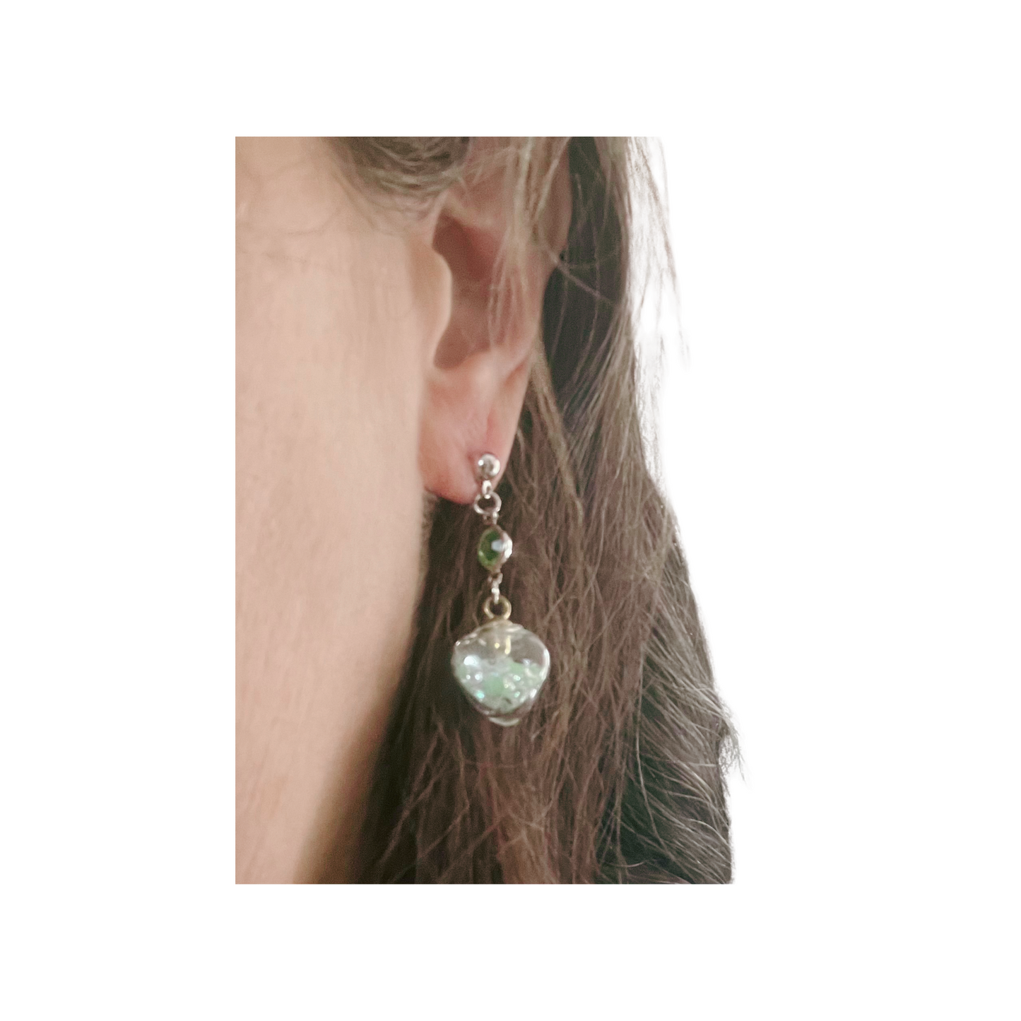 Green heart dangling earrings