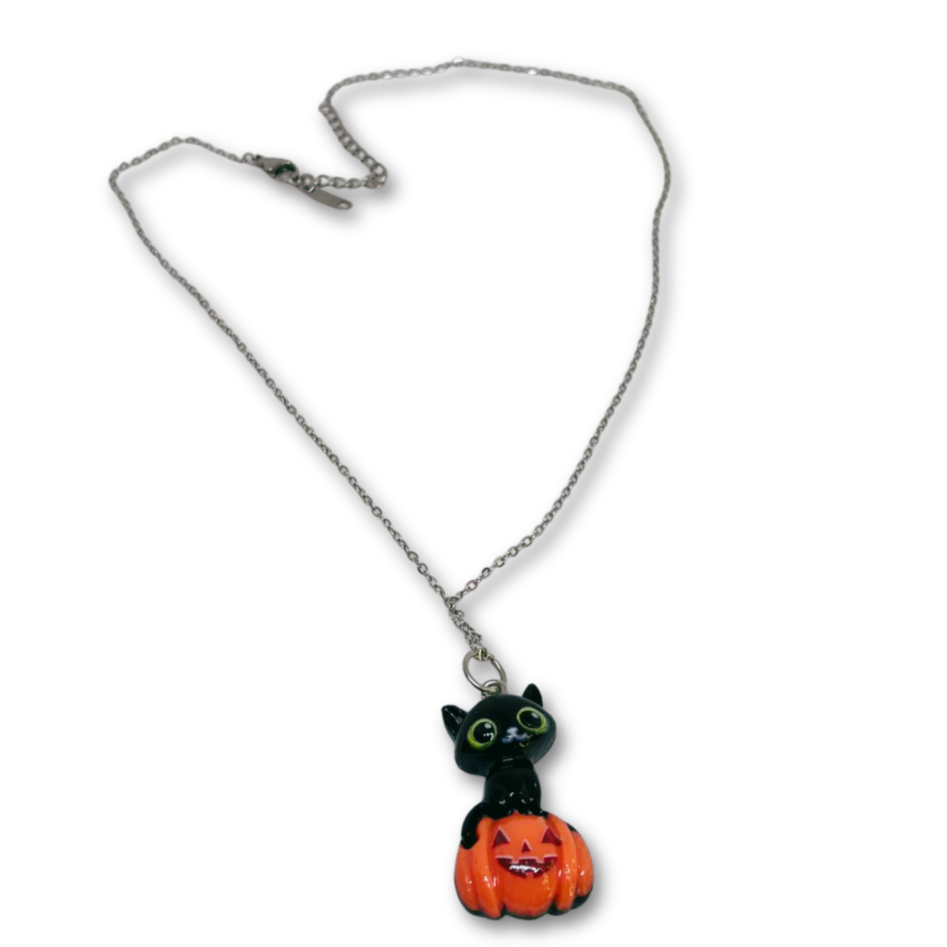 Necklace with a black cat in a pumpkin pendant.