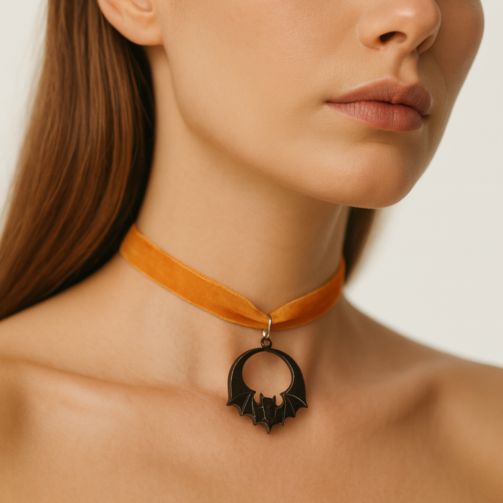 Halloween-themed orange choker with black bat pendant.