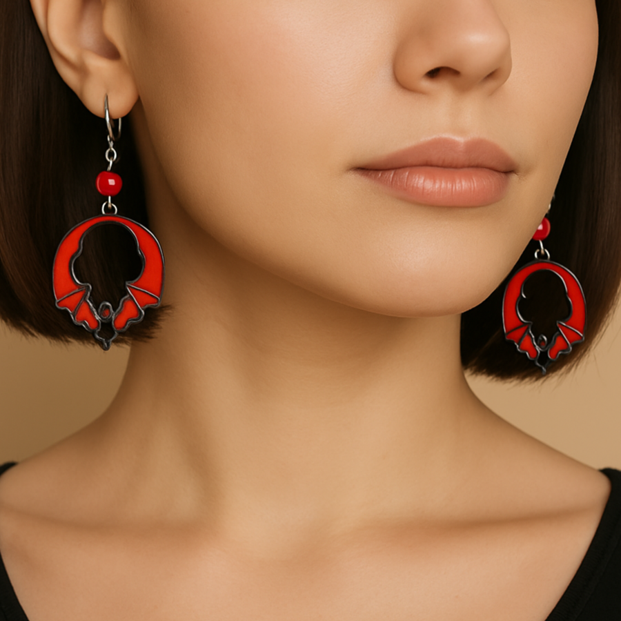 Halloween themed orange and black bat earrings.