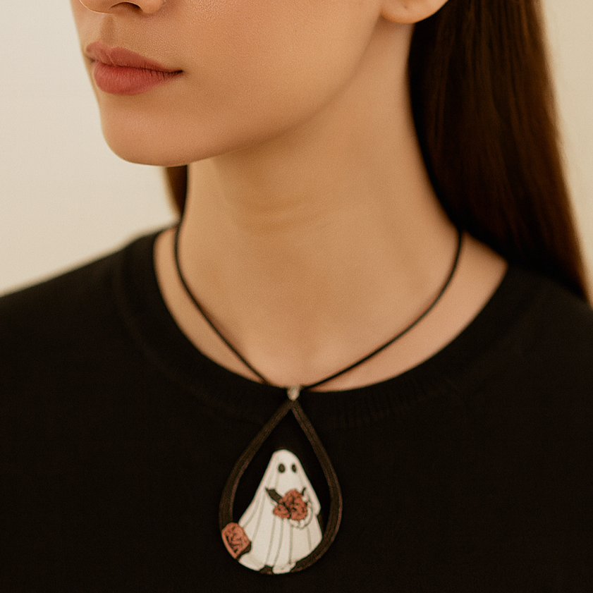 Leather cord necklace with a ghost pendant.