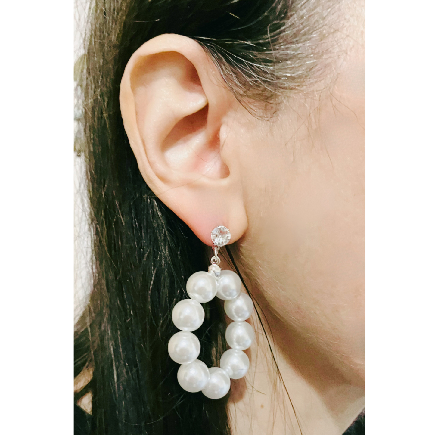 Imitation white pearl earrings.