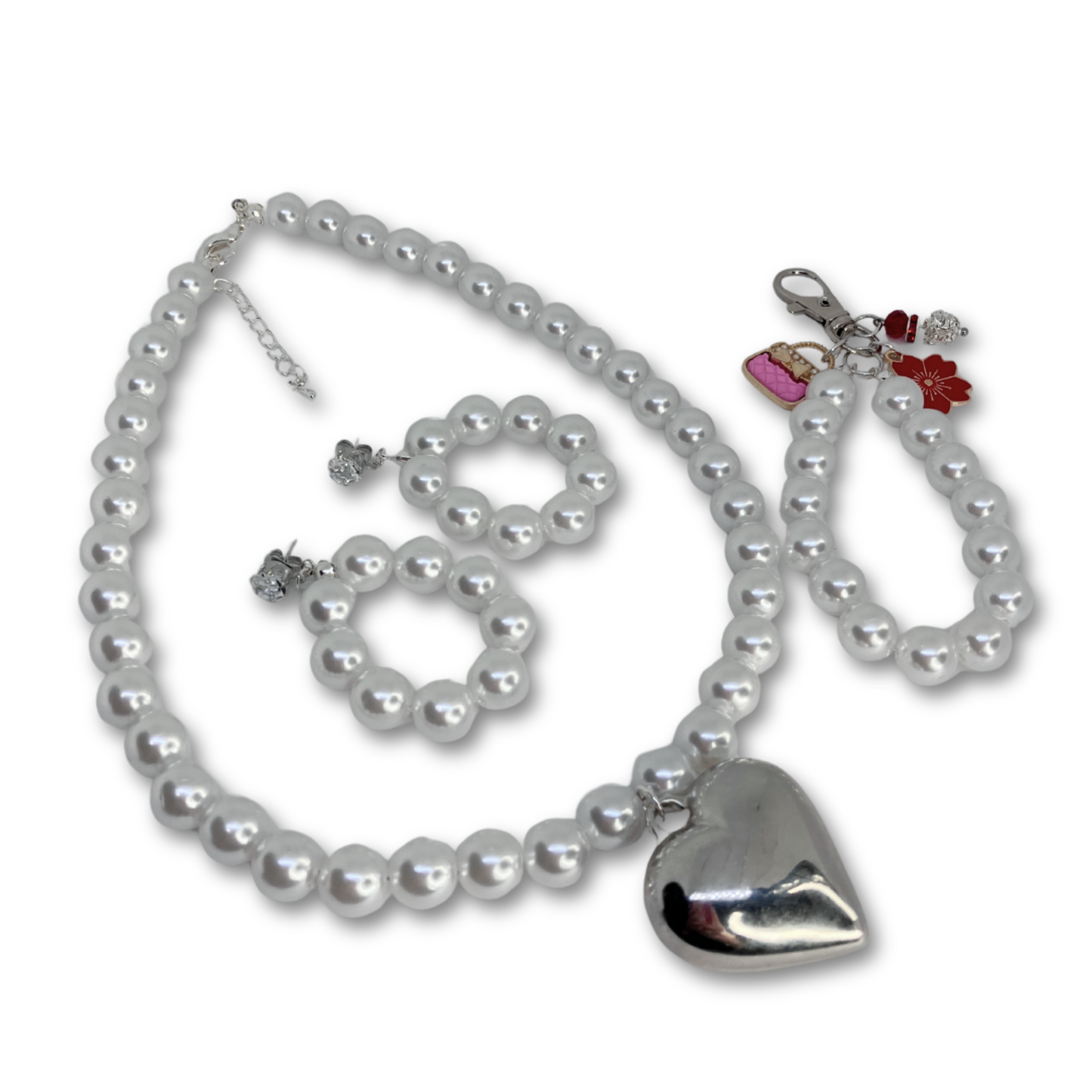 This set includes imitation white pearls necklace, matching earrings and handbag matching chain. Gift bag.