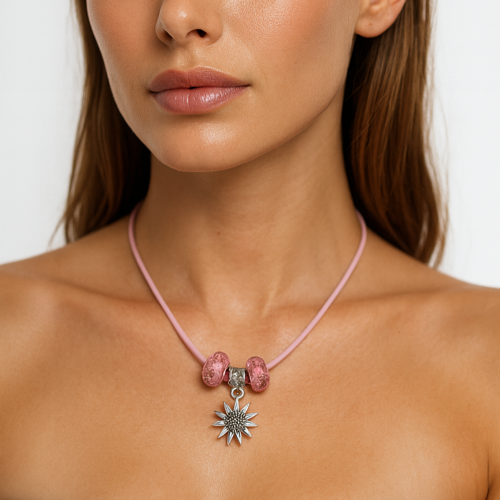 Pink cord necklace with pink glass charms and silver star.
