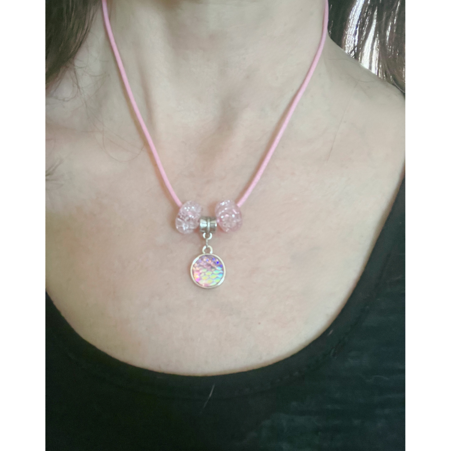 Pink cord necklace with pink glass beads.
