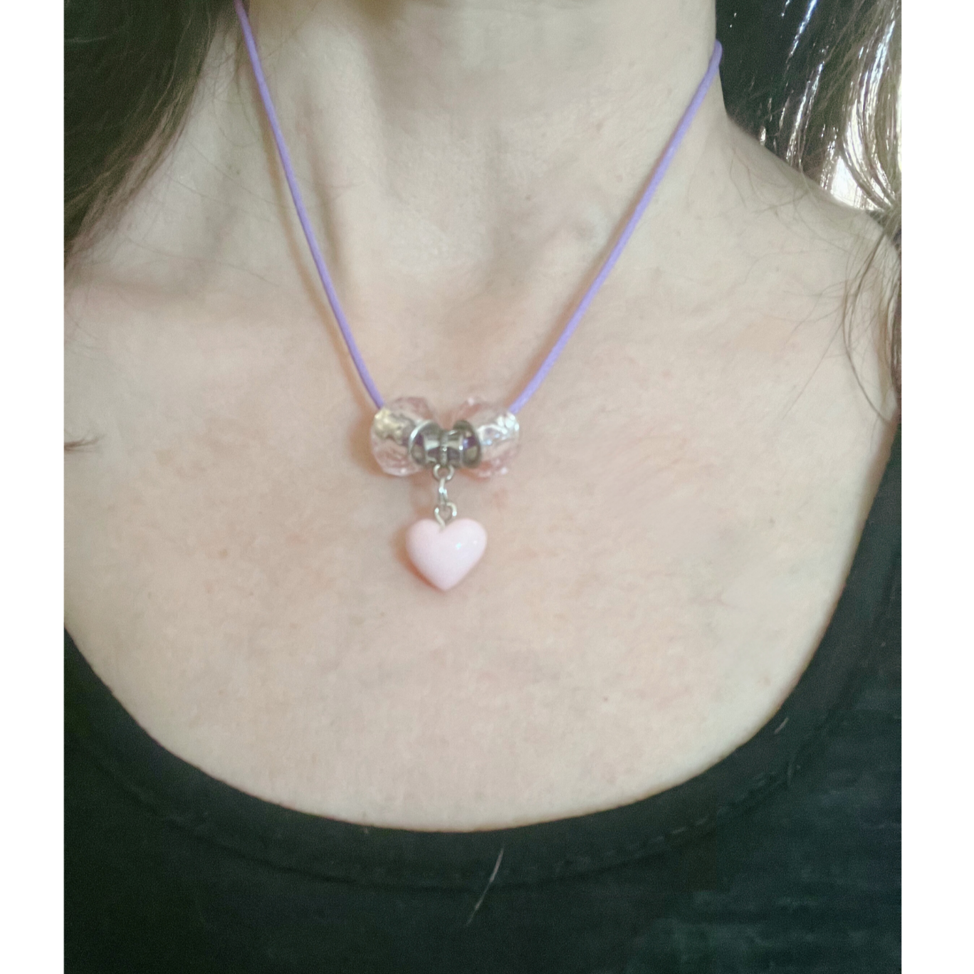 Purple cord necklace with glass pink beads and pink heart pendant.