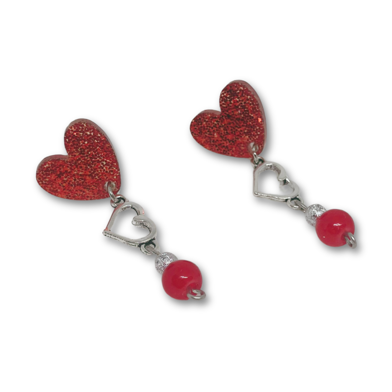 Red heart dangling earrings.
