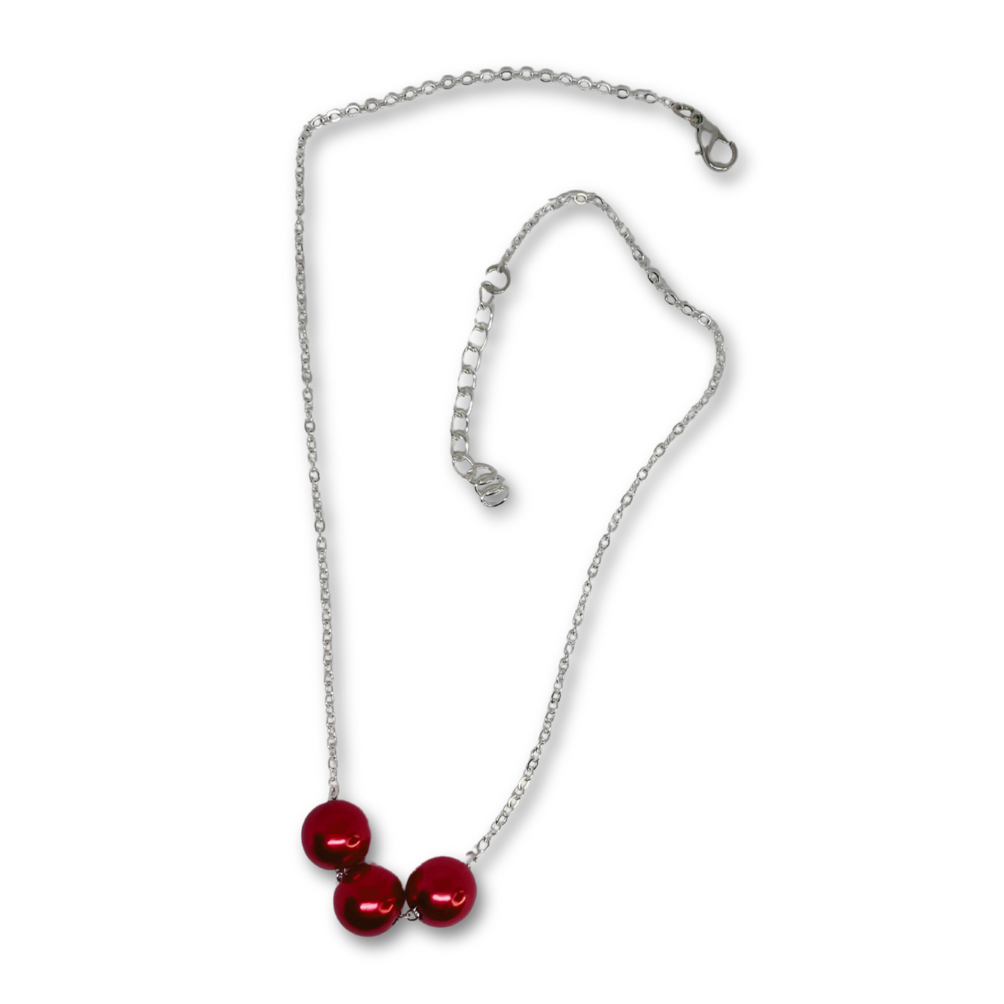 Silver chain necklace with red pearls.