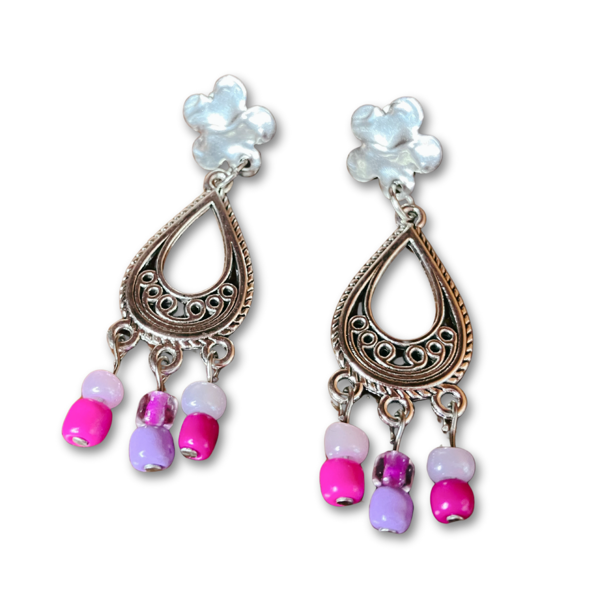 Silver dangling earrings with purple beads.