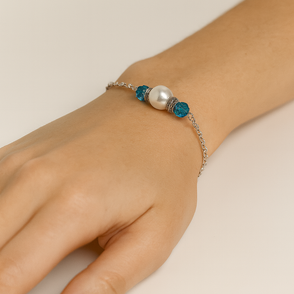 Silver bracelet with pearl and blue beads