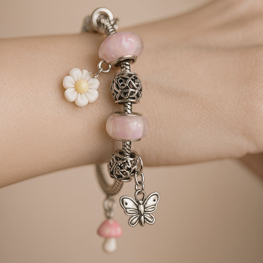 Bracelet with pink beads and charms.