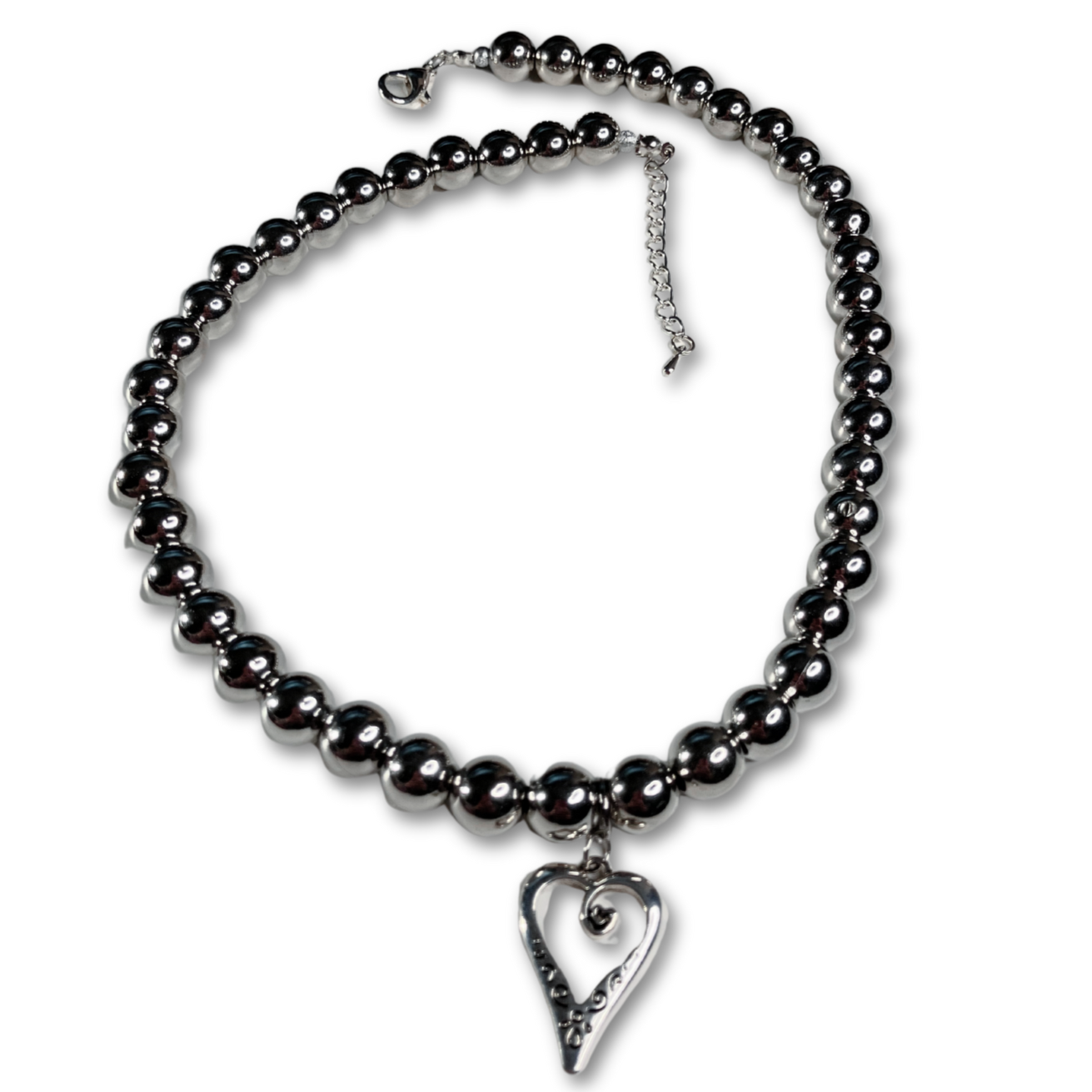 Silver pearls necklace with heart pendant.