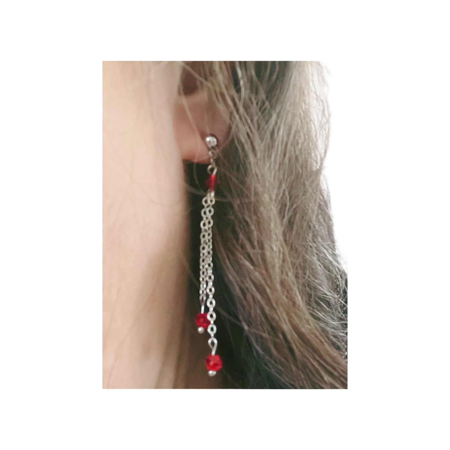 Silver chain dangling earrings with red beads