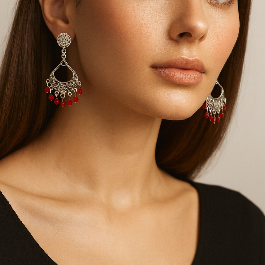 Silver earrings with red beads.