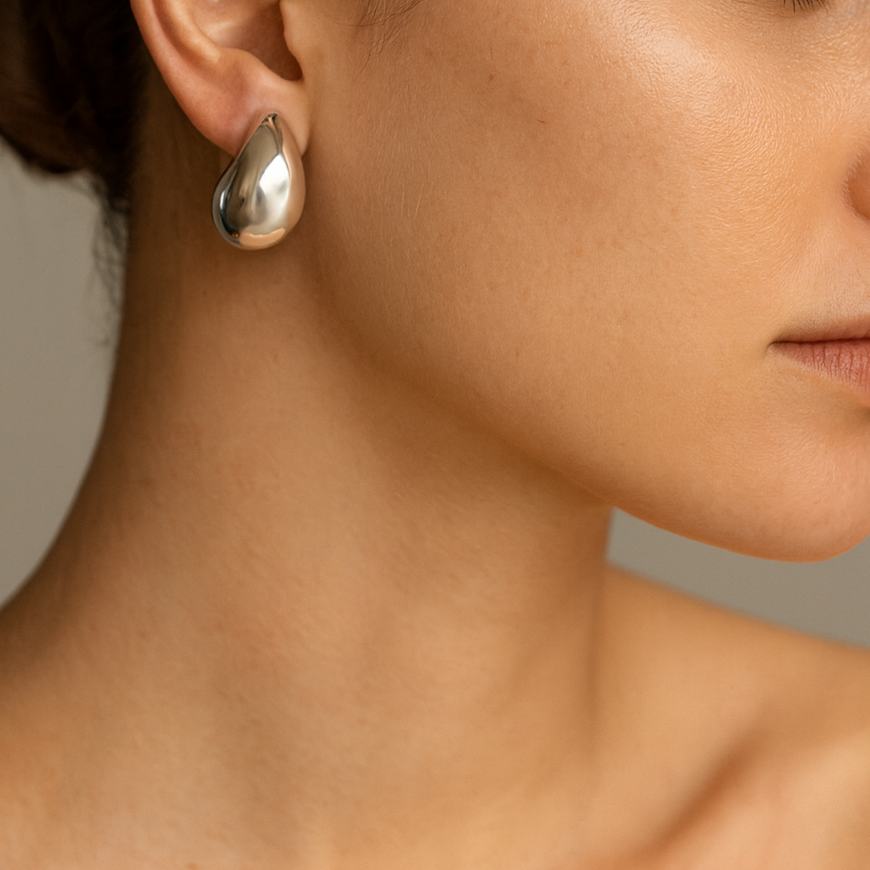 Silver teardrop earrings.