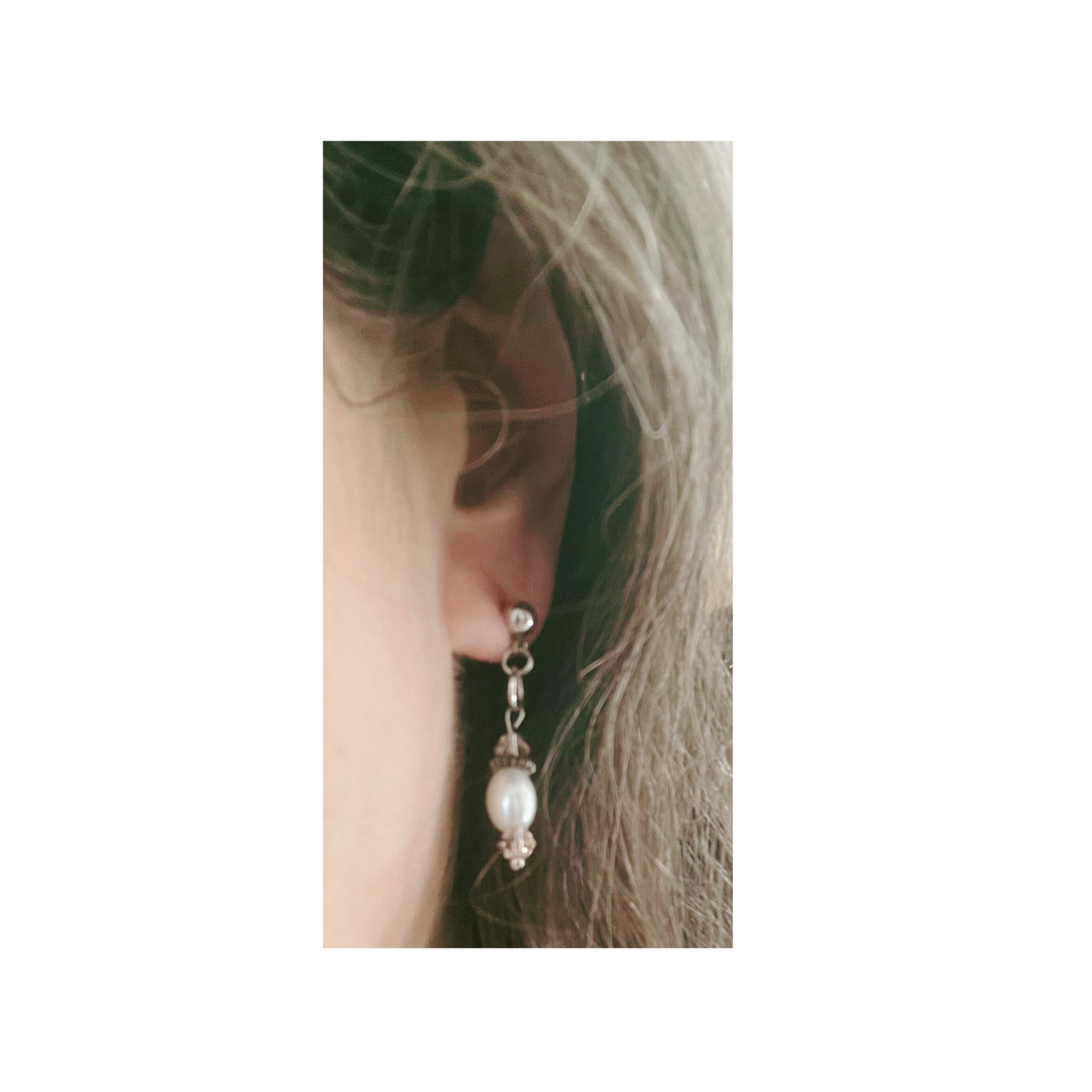 White pearl earrings with pink glass beads.