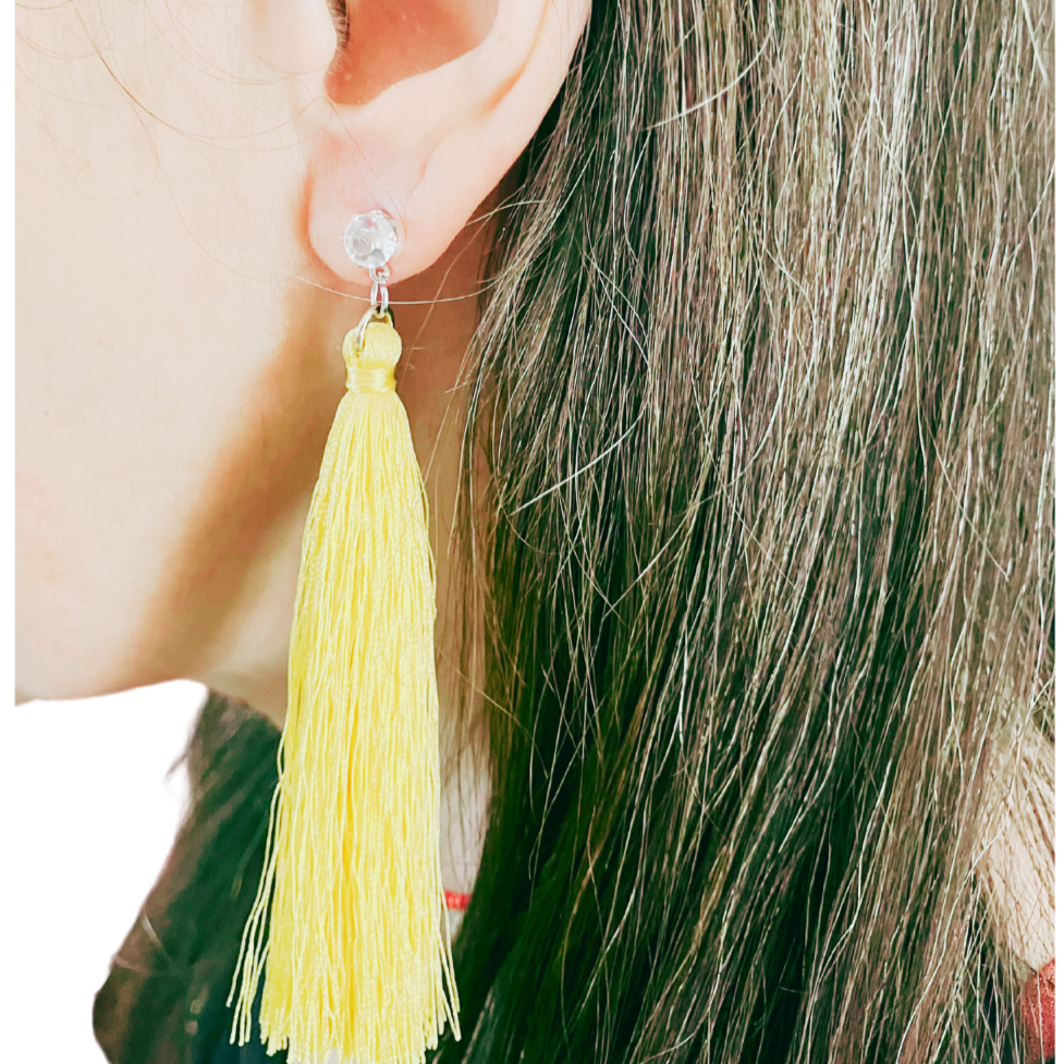 Yellow tassle earrings.