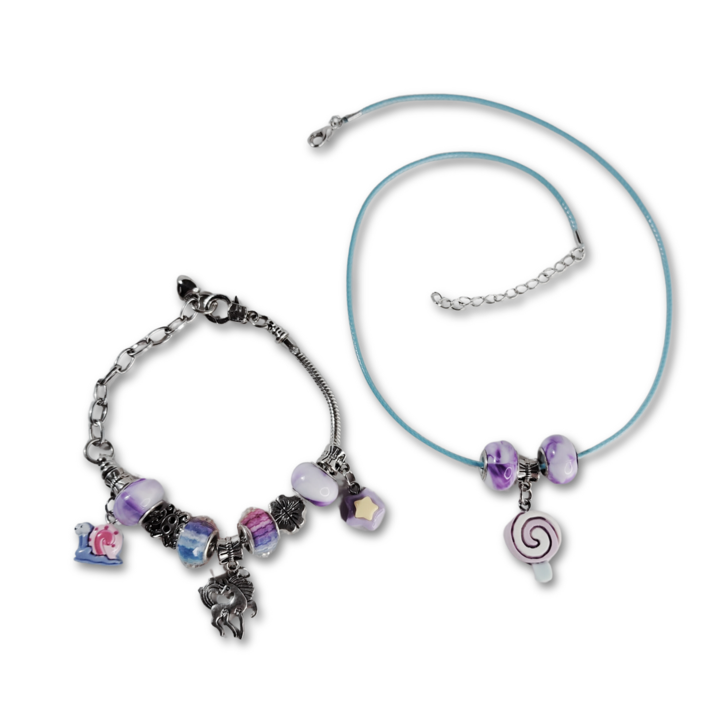 Beautiful swirling candy pendant necklace with purple beads around a blue material chain with matching unicorn charm bracelet with silver chain and colorful beads