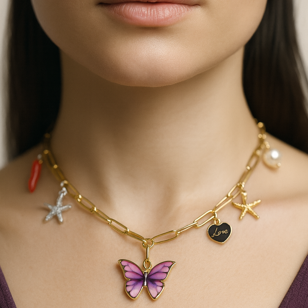 Gold necklace with butterfly pendant and other charms.