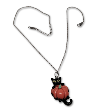 Halloween Pumpkin Perfection necklace consisting of a cute black cat holding his perfect pumpkin close
