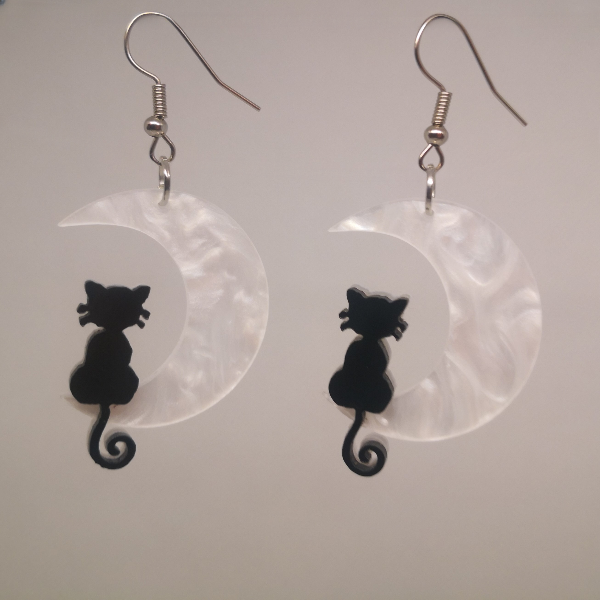 Moonlit cat earrings with light background