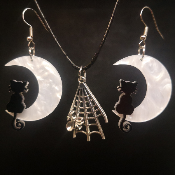 Moonlit cat earrings with spindle charm web necklace