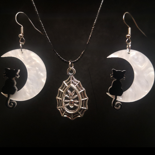 Moonlit cat earrings with spinning spider web necklace
