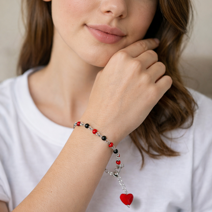 bracelet with a red heart charm