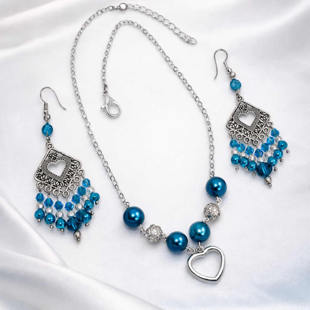 Celeste Dream Gift Set features silver necklace with blue pearls and matching dangling earrings. Gift bag.