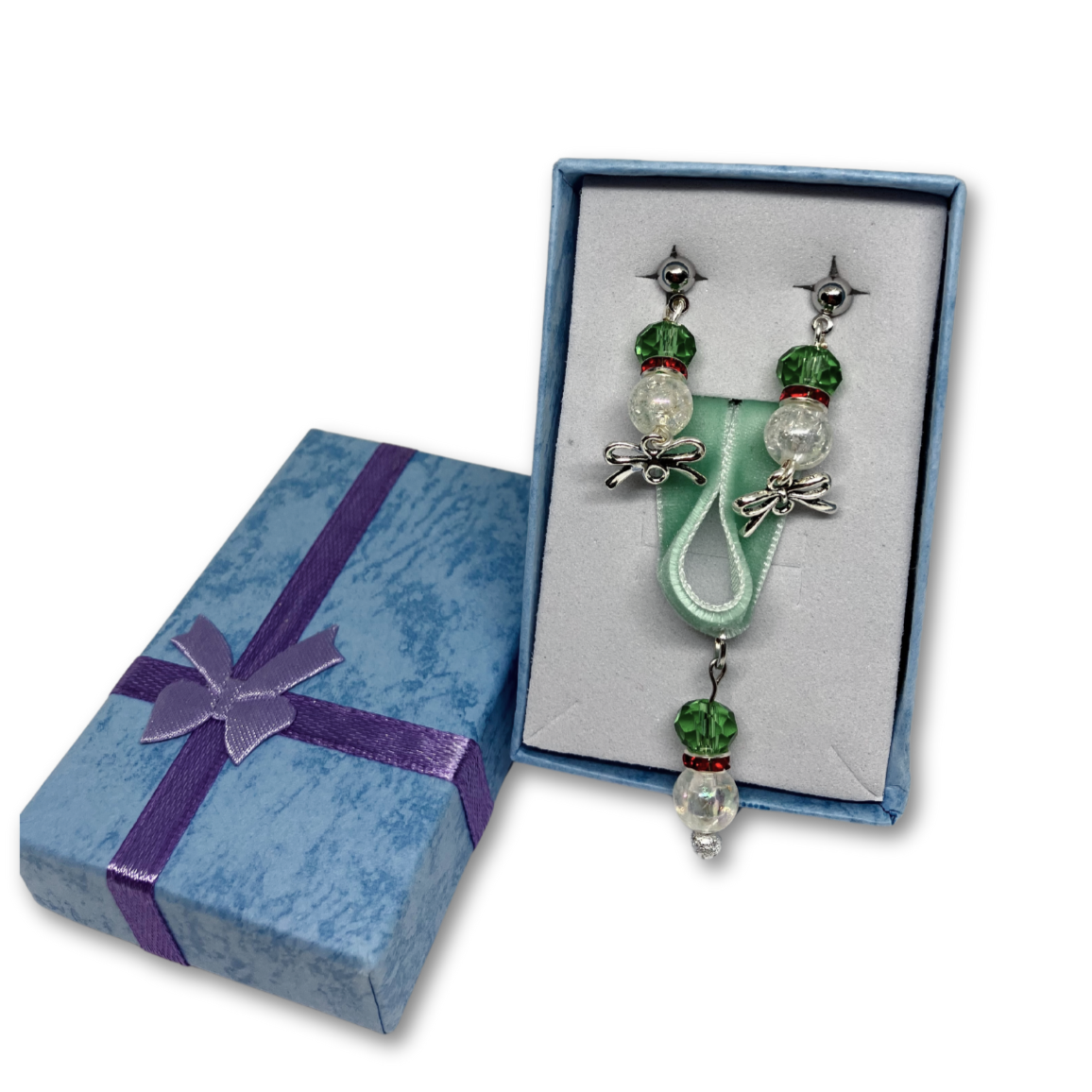 Christmas gift of green velvet choker with matching earrings. Blue gift box.