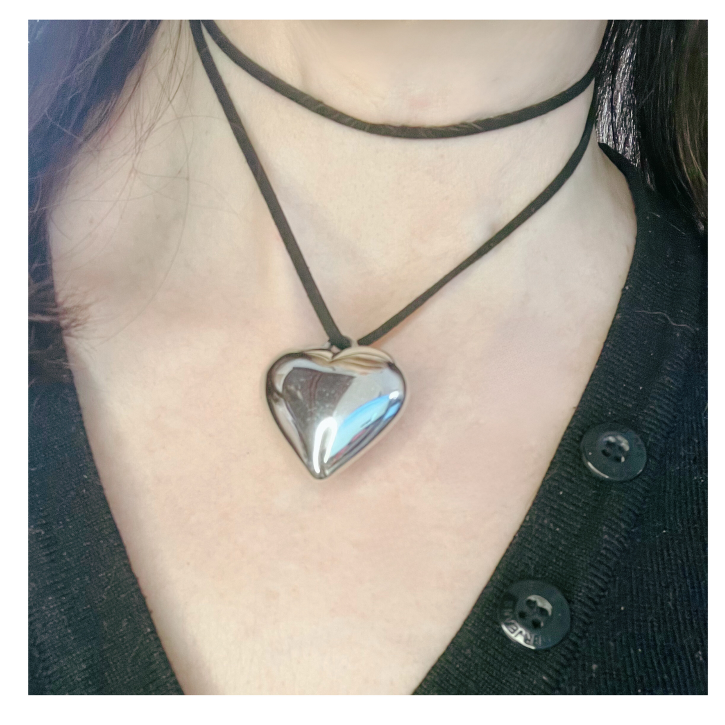 Black suede cord necklace with silver heart.