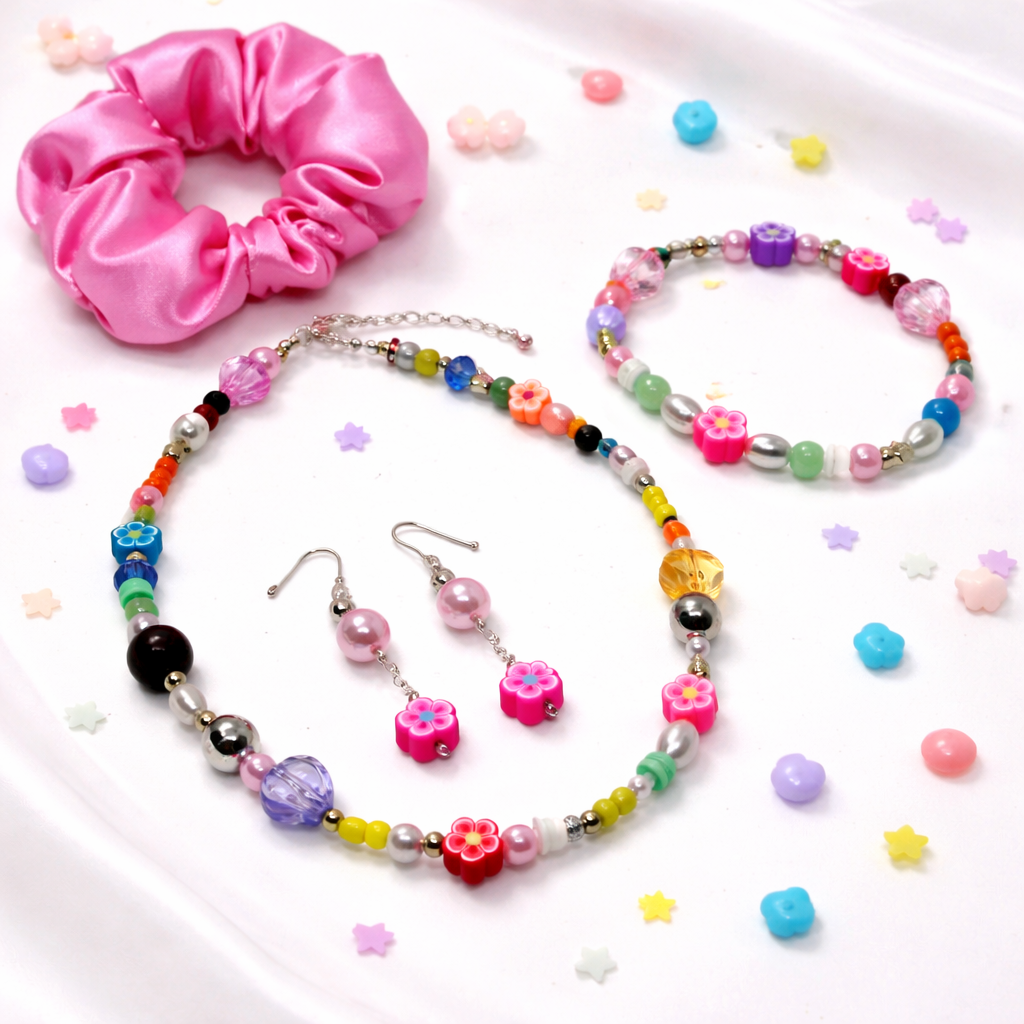 This set includes: Satin Pink Hair Scrunchie, Multi color Beaded Necklace, matching Bracelet and Dangling matching Earrings.