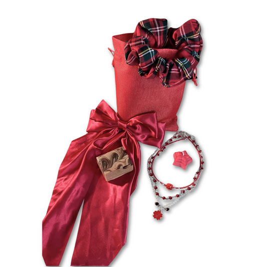 Serene Ruby gift set for women, featuring  artisan mini cinnamon soap, stack necklaces, wax scented candle, red plaid hair scrunchie and red satin hair bow. All packed in gift bag.  