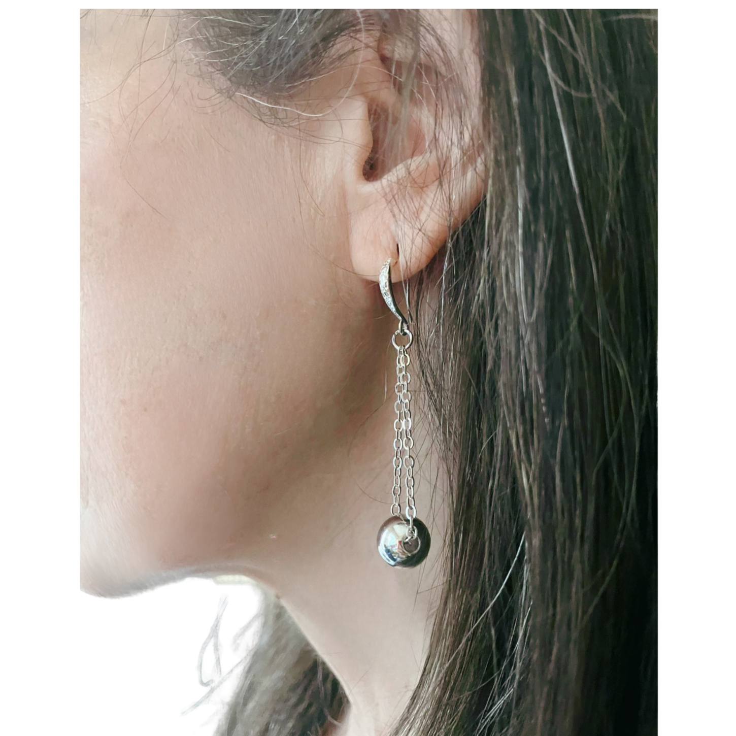 Silver dangling earrings with silver bead
