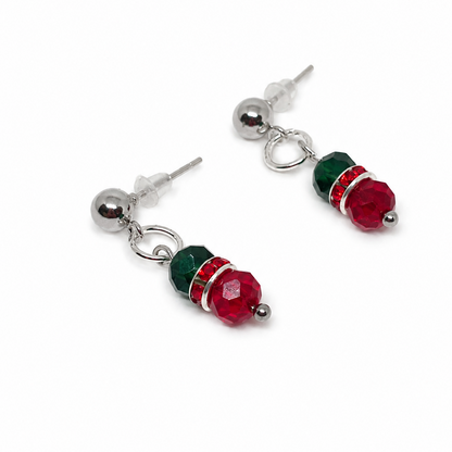 Silver-tone dangle earrings featuring faceted green and red beads.
