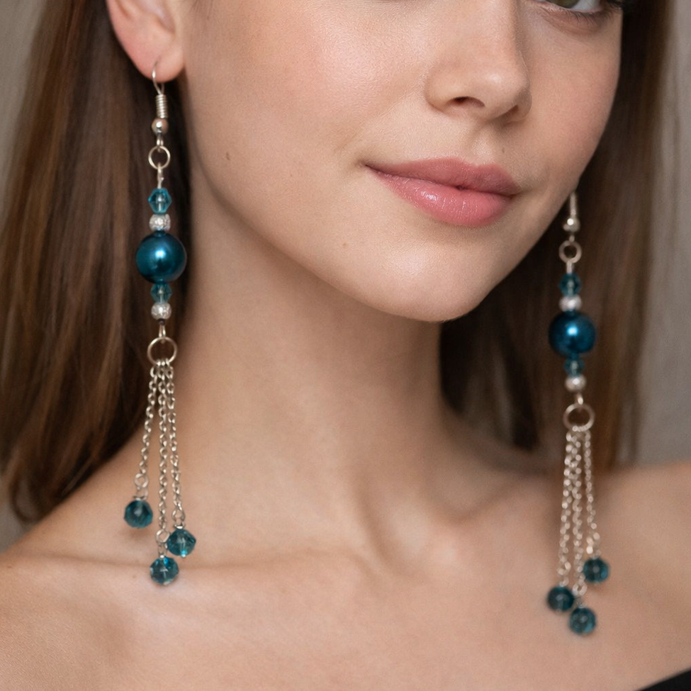 Blue and silver dangling earrings.