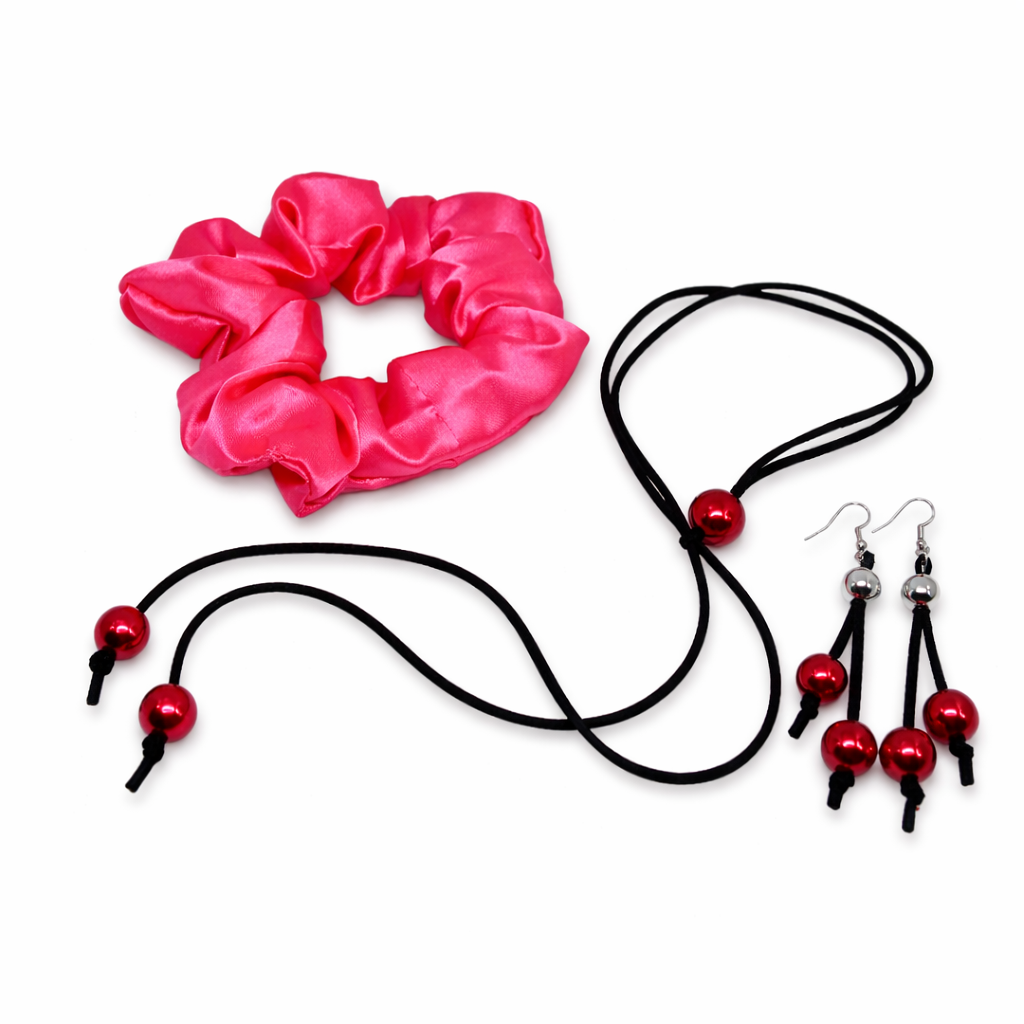 Serene Glow gift set for women, feature red satin scrunchie for hair, black suede cord with red beads, matching dangling earrings.
Packed in gift bag.