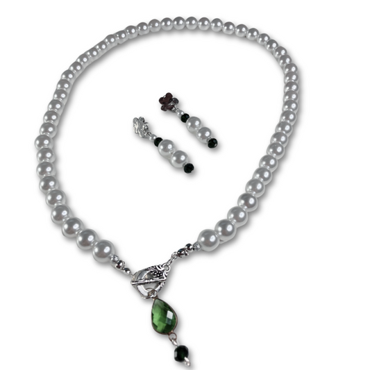 The Elegant Pearl Gift Set for women featuring white pearls necklace with green stone pendant and matching pearl earrings. 