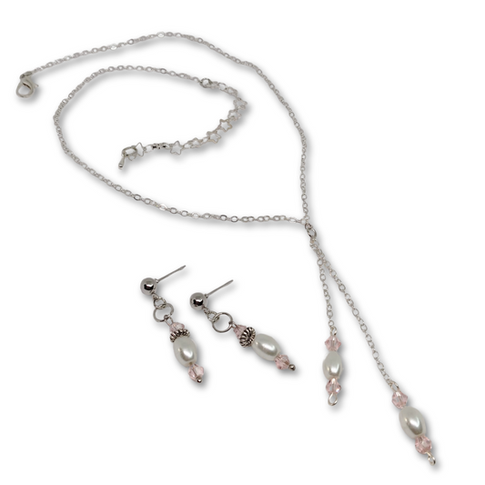 The Everyday Bliss gift set for women featuring silver necklace with white imitation pearl and pink glass beads with matching earrings.