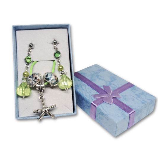 The Everyday Coastal Charm gift set for women featuring green ocean themed necklace with starfish charm and earrings within a gift box