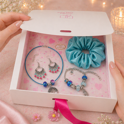 Set of jewelry and scrunchie in a decorative box with pink interior