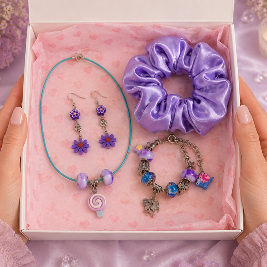 Set of purple jewelry including necklace, earrings, and bracelet in a gift box.
